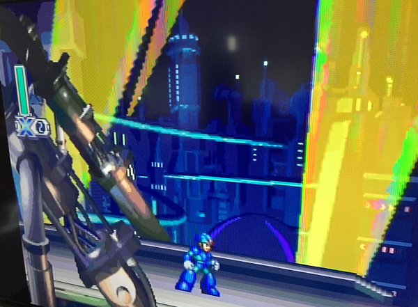 Mega Man X4 running on a modern TV with composite cables
